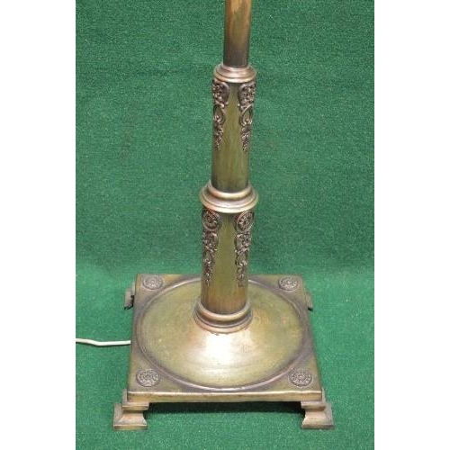 101 - Adjustable metal standard lamp having a square base and standing on four stepped bracket style feet