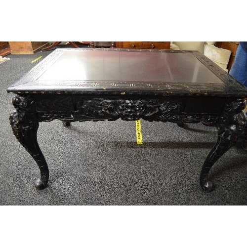 104 - Oriental style painted centre table the top having slate insert surmounted by a Greek Key style bord... 