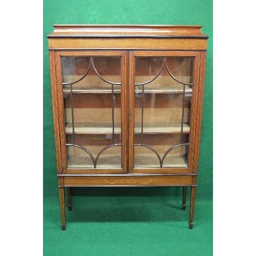 107 - Inlaid Edwardian mahogany display cabinet having two glazed doors enclosing a lined interior and two... 