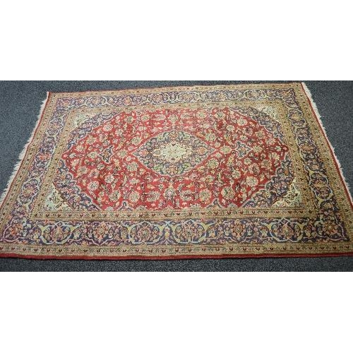 108 - Red ground carpet having blue ground border and floral pattern - approx 3.01m x 1.98m