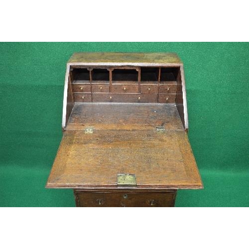 126 - Georgian oak bureau having fall front opening to reveal fitted interior of pigeon holes and drawers ... 