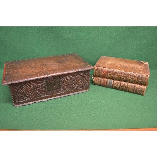 140 - Period oak bible box the top lifting to reveal storage space and having carved panelled front togeth... 