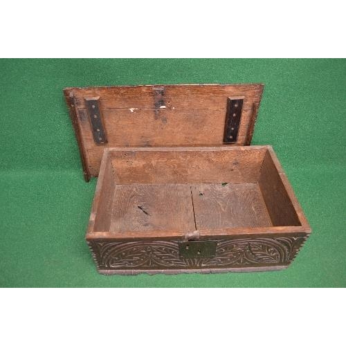 140 - Period oak bible box the top lifting to reveal storage space and having carved panelled front togeth... 