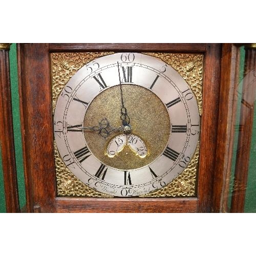 215 - Wright, Warwick, oak cased grandfather clock having brass face with silvered dial, black Roman Numer... 