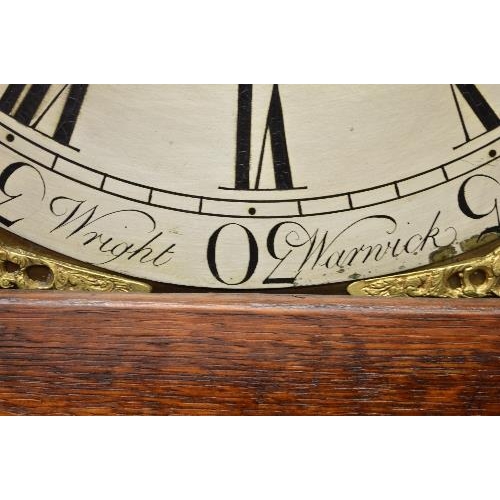 215 - Wright, Warwick, oak cased grandfather clock having brass face with silvered dial, black Roman Numer... 