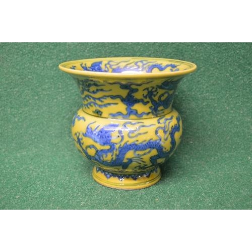 317 - Chinese yellow glazed vase having a bulbous body with fluted top, standing on a circular footed base... 