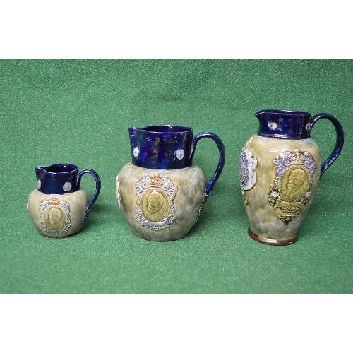 323 - Set of three graduating Royal Doulton Coronation jugs for the Coronation of King George V and Queen ... 