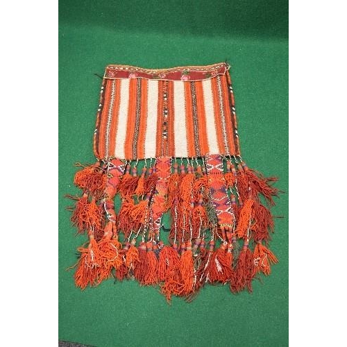 353 - Large woven Arabian camel saddle having orange and black woven pattern with tassels - 28.5