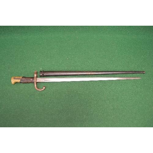 411 - French bayonet numbered 48886 with metal scabbard numbered 64286 the blade having French engraving a... 