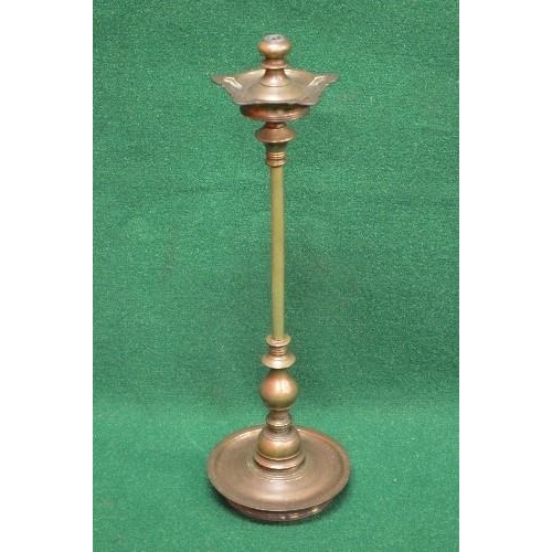 427 - 19th century bronze temple oil lamp having shaped top with turned finial supported on a column leadi... 