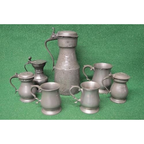 430 - Group of seven pewter vessels to comprise: three tankards, pair of lidded tankards and two lidded ju... 