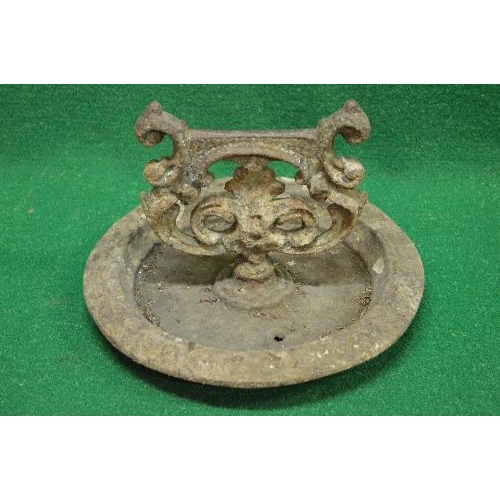 434 - Victorian iron boot scraper having scrolled uprights leading to a circular base with decorative bord... 