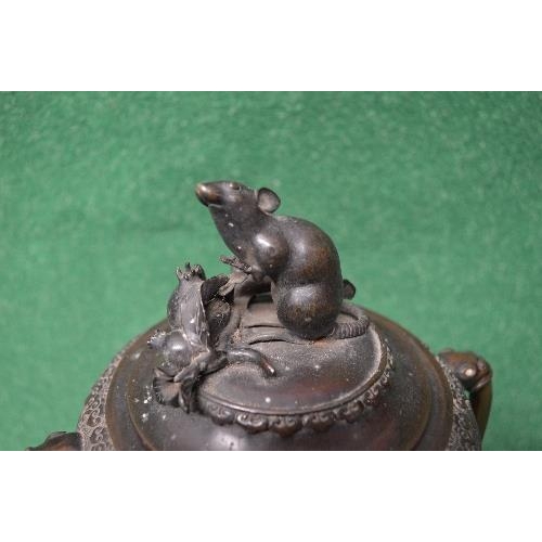 454 - Oriental bronze two handled lidded urn the lid having mouse and fruit finial, the cylindrical body h... 