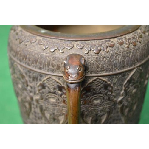 454 - Oriental bronze two handled lidded urn the lid having mouse and fruit finial, the cylindrical body h... 