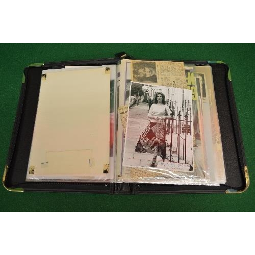 460 - Folio containing a quantity of signed pictures and newspaper articles etc relating to various writer... 