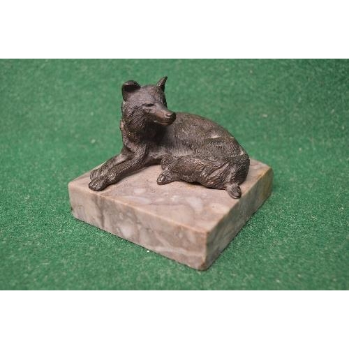 467 - Bronze figure of a recumbent fox on a square grey marble base - 3.25