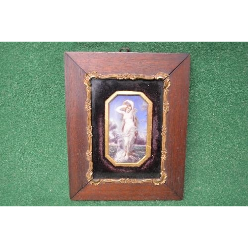 468 - Framed miniature painting of a semi nude woman standing on a rock at sea with a gilt card mount surm... 