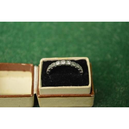 478 - 18ct white gold ladies ring set with single band of ten small diamonds