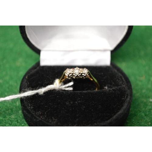 482 - 18ct gold ladies ring set with a row of three small diamonds (gross weight 2.8gms)