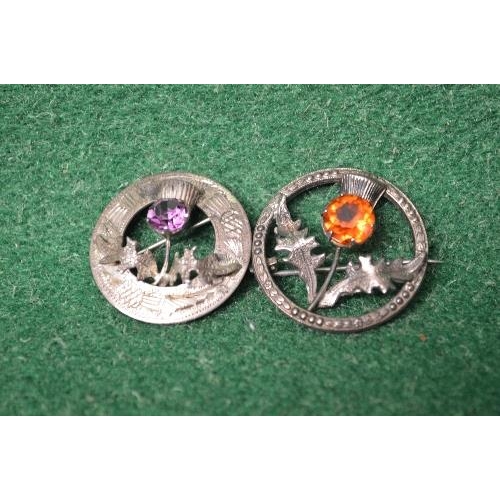 485 - Two Sterling Silver Scottish thistle brooches one set with amethyst and the other with orange citrin... 