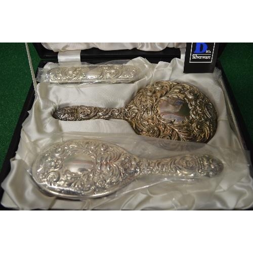 490 - Cased silver dressing table set to comprise: hand mirror, clothes brush and hair brush, marked for B... 