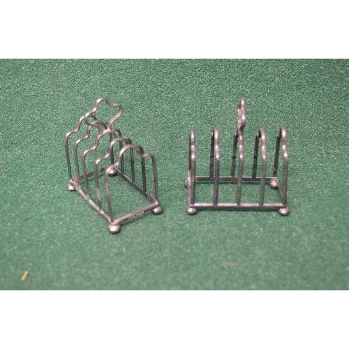 506 - Pair of silver five bar toast racks having pierced handle, marked for Sheffield