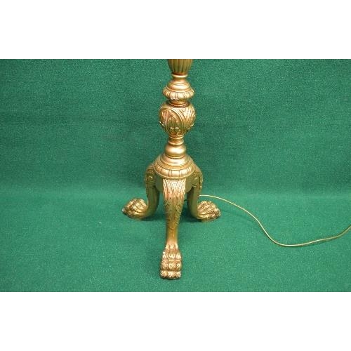 58 - Giltwood standard lamp having reeded and carved column leading to three cabriole legs ending in lion... 