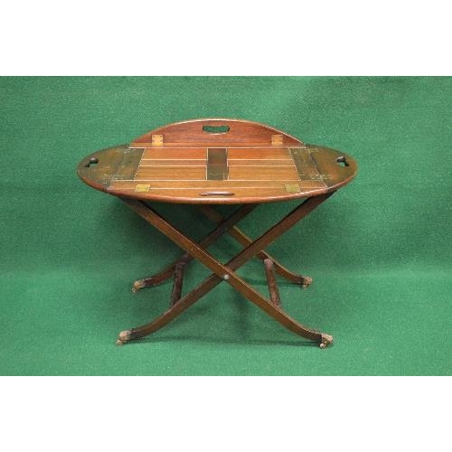 62 - 20th century mahogany butlers tray on stand having four pierced folding carry handles supported on a... 