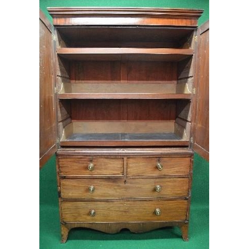 73 - 19th century mahogany linen press having moulded cornice over two panelled doors opening to reveal t... 