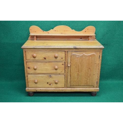 83 - Victorian pine dresser base having raised back with shelf over three graduated left hand drawers wit... 