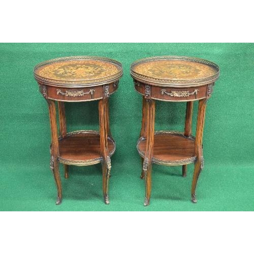 85 - Pair of 20th century mahogany inlaid two tier occasional tables the tops having brass pierced galler... 