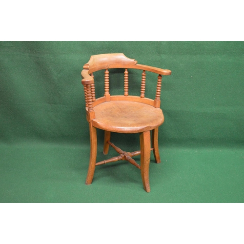 111 - Bow back captains style chair having scrolled arms supported on bobbin turned spindles leading to a ... 