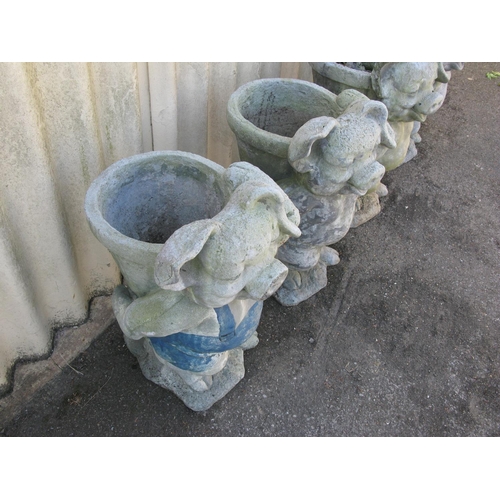 160 - Four fibre/cement pig formed planters  - 27.5