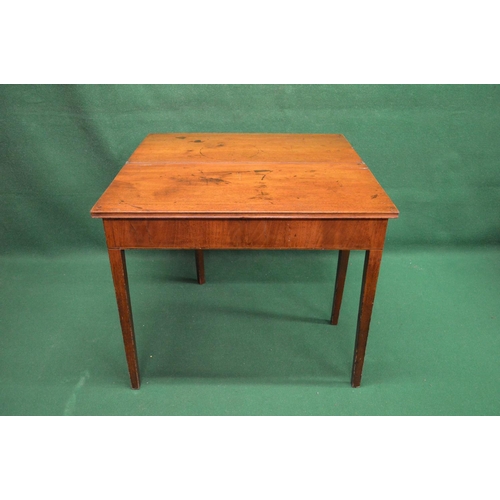 22 - 19th century mahogany fold over tea table standing on square tapering legs - 33.75