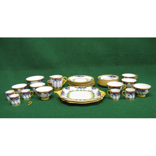 256 - Adderleys Anemone pattern part tea and coffee set having floral pattern on a white ground with yello... 