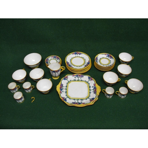 256 - Adderleys Anemone pattern part tea and coffee set having floral pattern on a white ground with yello... 