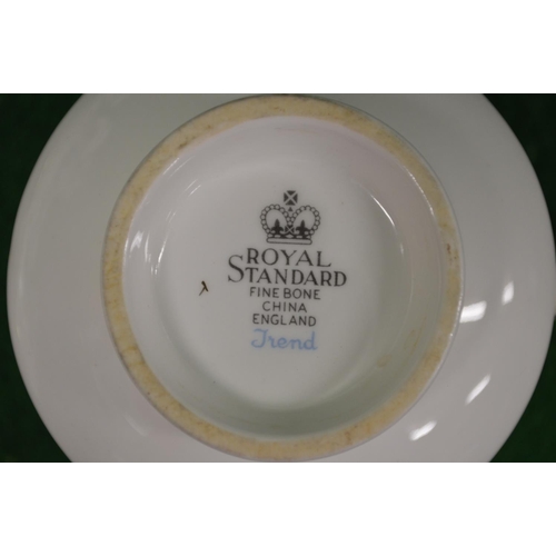 276 - Royal Standard fine bone china Trend pattern tea service having white ground with blue and green lea... 