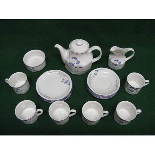 292 - Royal Doulton Minerva pattern teaset having a white ground with blue iris decoration and dark blue b... 