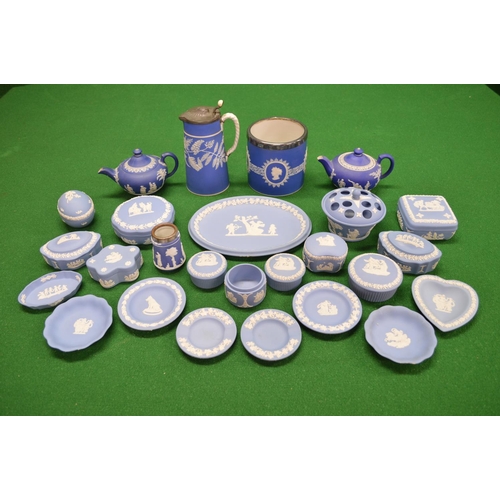 294 - Group of blue Wedgwood Jasperware to include: rose bowl, ten lidded trinket boxes, two teapots, jug,... 