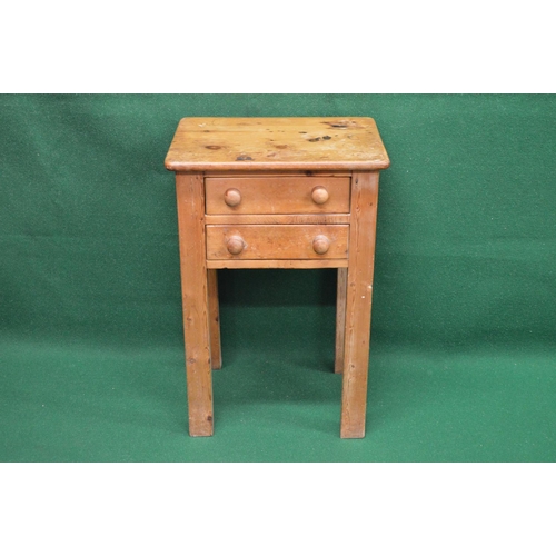 30 - Pine side table having rectangular top over two short drawers with knob handles, standing on square ... 