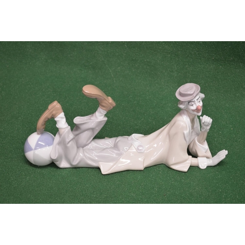 318 - Lladro figure entitled Clown lying with beach ball by his feet - 14.75