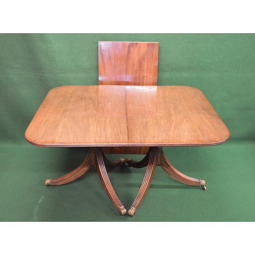 38 - 19th century mahogany twin pillar dining table with additional leaf, the top having rounded corners ... 