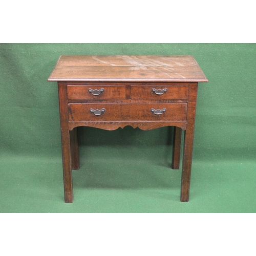 40 - 19th century oak side table having two short and one long drawer over a shaped frieze, standing on s... 