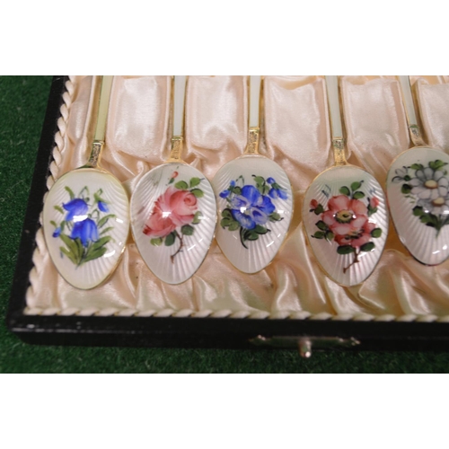 446 - Set of six silver and enamel coffee spoons having floral decoration of handles and bowls, marked for... 