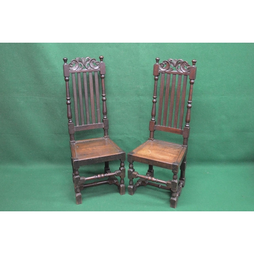 48 - Pair of oak high back hall chairs having pierced top rails over moulded vertical slats and turned up... 