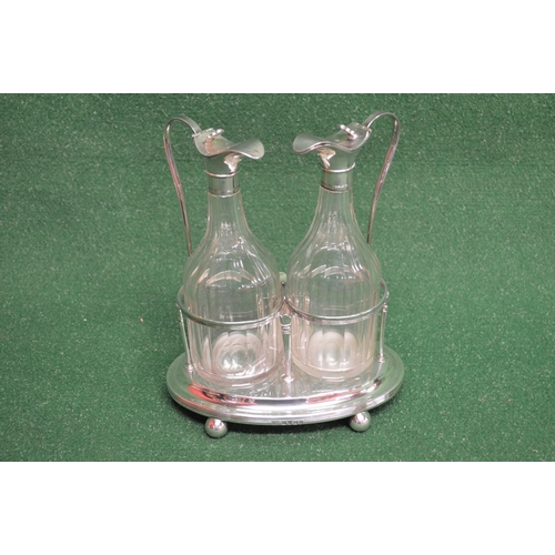 485 - Pair of glass ewers having white metal tops and standing on silver stand with ball feet, marked for ... 