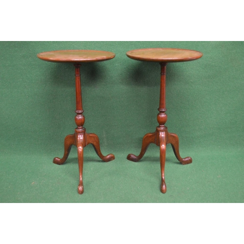 57 - Pair of 20th century mahogany wine tables having circular tops supported on turned columns leading t... 