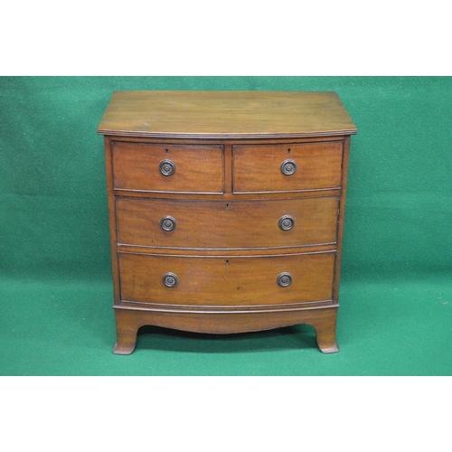 58 - Mahogany bow fronted chest of two short and two long drawers with hoop handles, standing on swept br... 