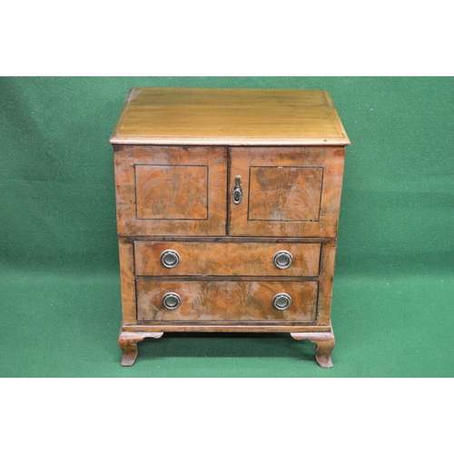 62 - 19th century mahogany converted commode having two doors over two drawers with brass handles, standi... 