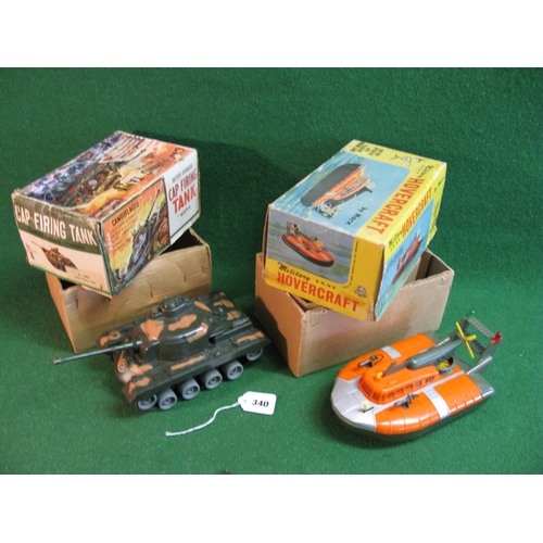 340 - Louis Marx & Co. Ltd Swansea: cap firing tank and military hovercraft, both battery operated, of met... 